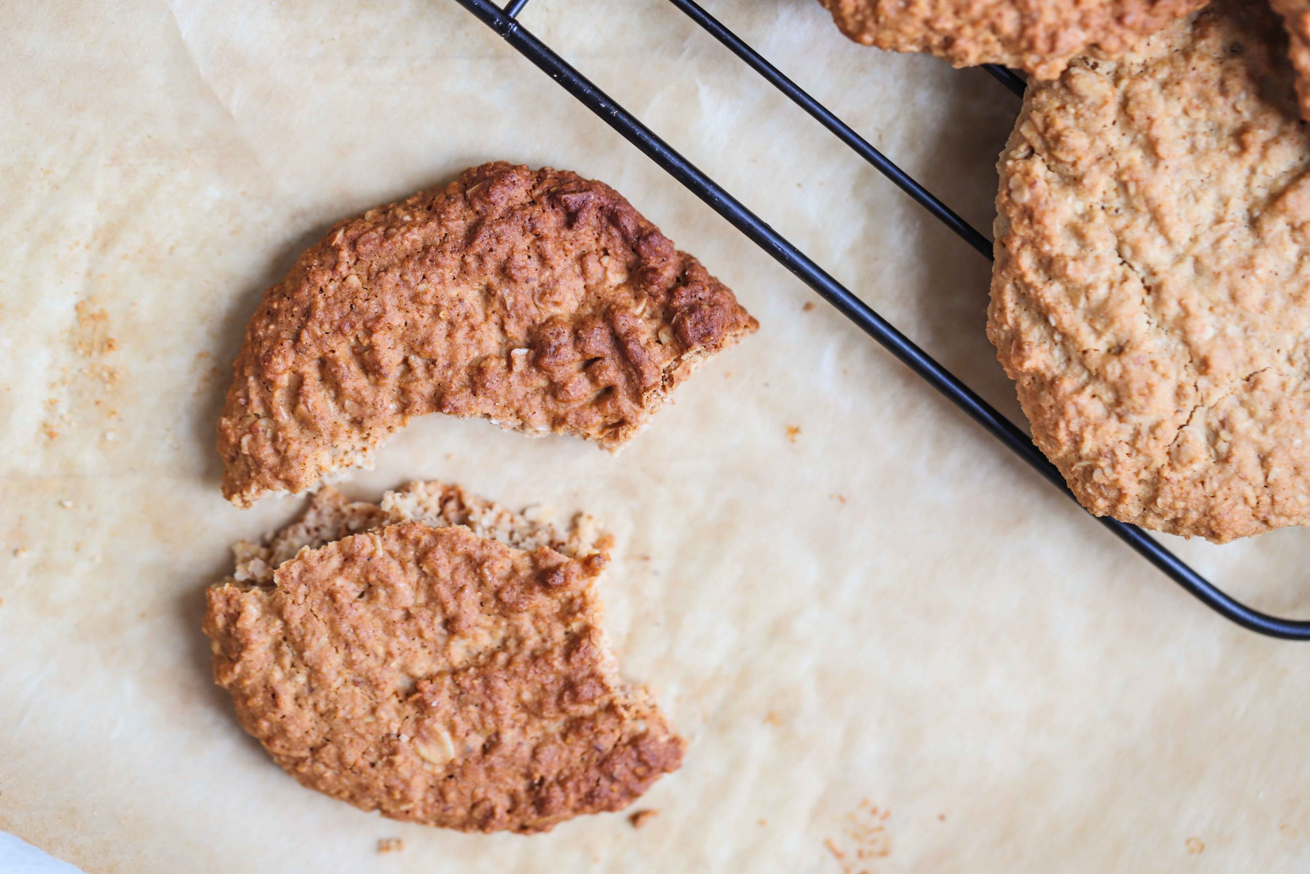 broken oatmeal cookie on a cooling rack