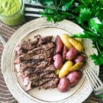 how do you cook a ribeye - ribeye on a plate with potatoes