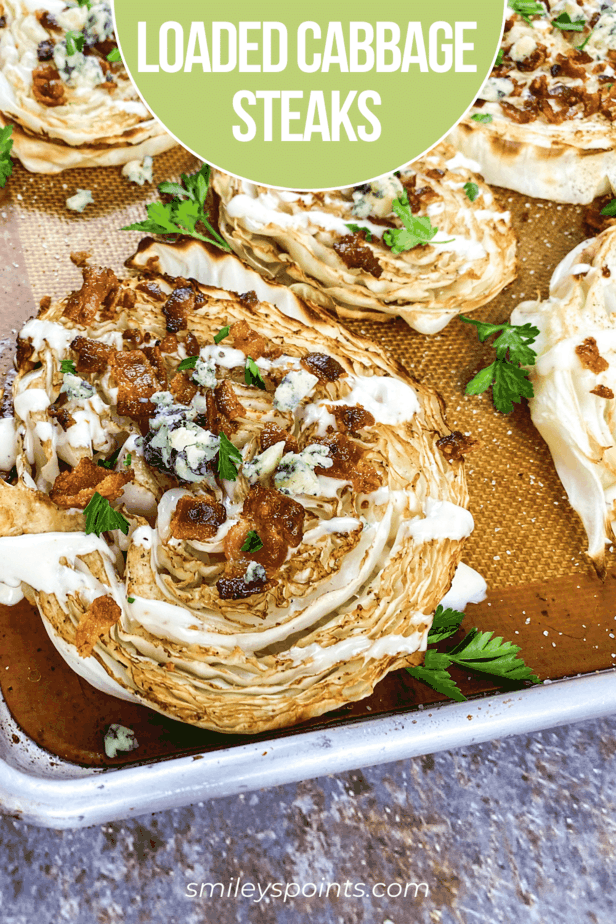 loaded cabbage steaks with bacon on cookie sheet