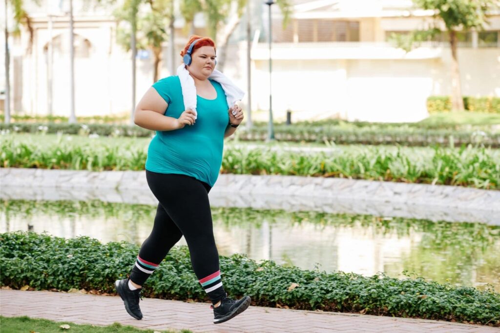 Woman running with headphones on