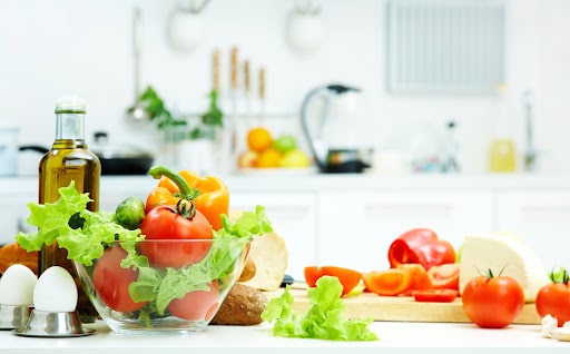 healthy foods are on the table in the kitchen